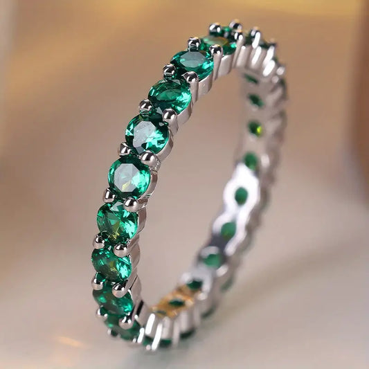 Anello Eternity Luneth Ardenelle | Color Oro Bianco e Verde Smeraldo