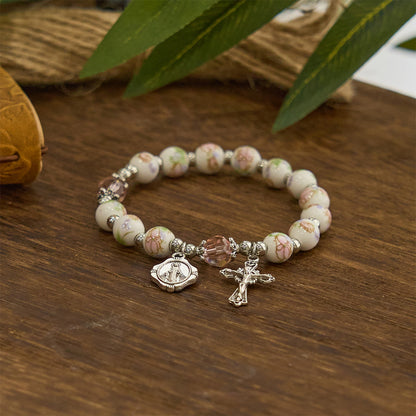Bracciale Elasticizzato in Ceramica Floreale Multicolore con Medaglia Miracolosa e Crocifisso: Sottile Eleganza della Fede