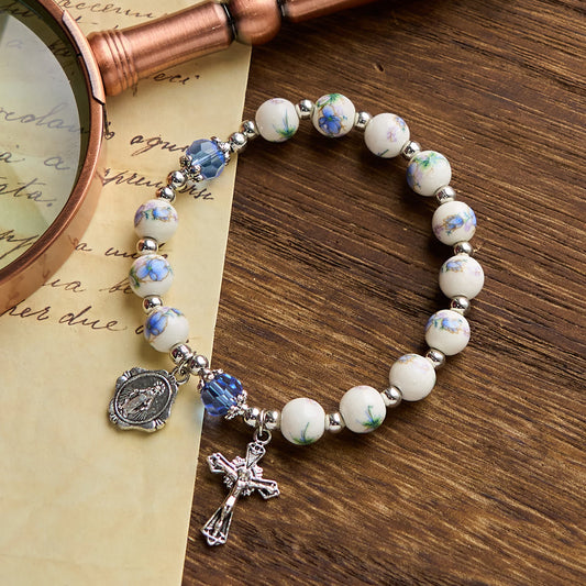 Bracciale Elasticizzato in Ceramica Floreale Multicolore con Medaglia Miracolosa e Crocifisso: Sottile Eleganza della Fede