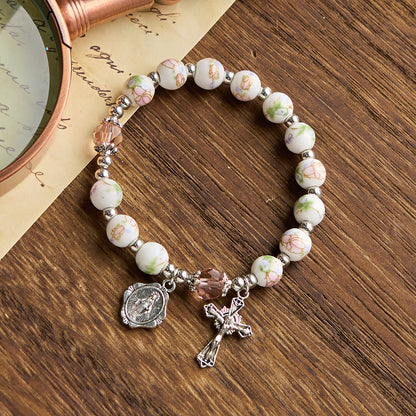 Bracciale Elasticizzato in Ceramica Floreale Multicolore con Medaglia Miracolosa e Crocifisso: Sottile Eleganza della Fede