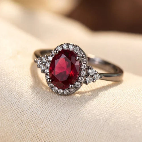 Anello halo rubino in argento