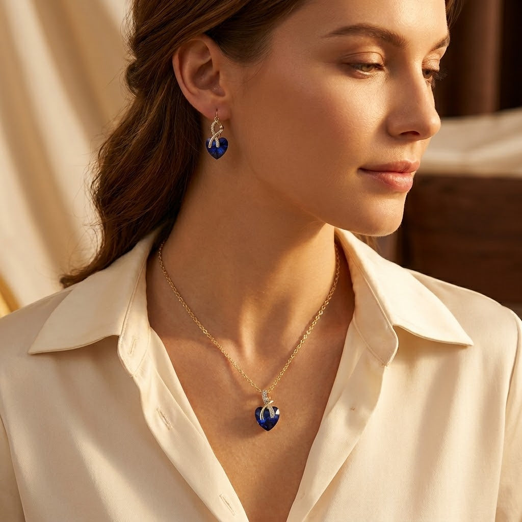 Set collana e orecchini a forma di cuore in zaffiro d'oro