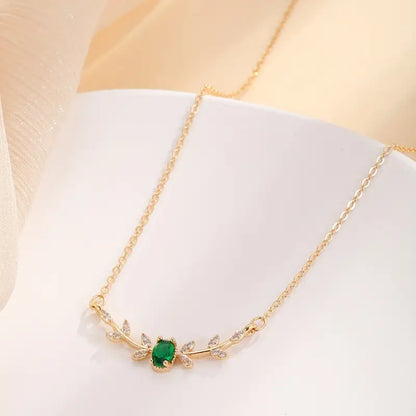 Collana Amira Valmorin | Dorata con Ramo e Pietra Verde Smeraldo
