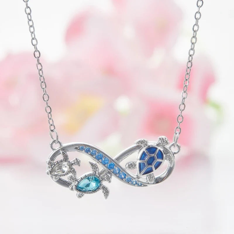 Collana Infinito con Tartarughe Marine e Cristalli Blu