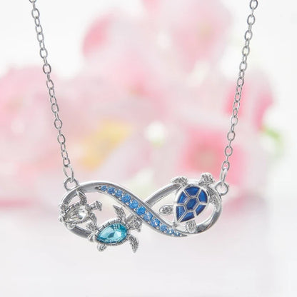 Collana Infinito con Tartarughe Marine e Cristalli Blu