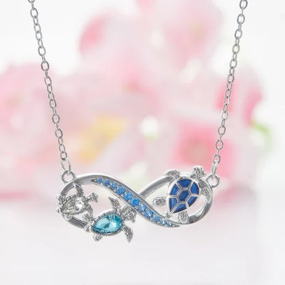 Collana Infinity con Tartarughe Marine e Crystals Blu