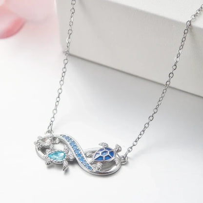 Collana Infinity con Tartarughe Marine e Crystals Blu