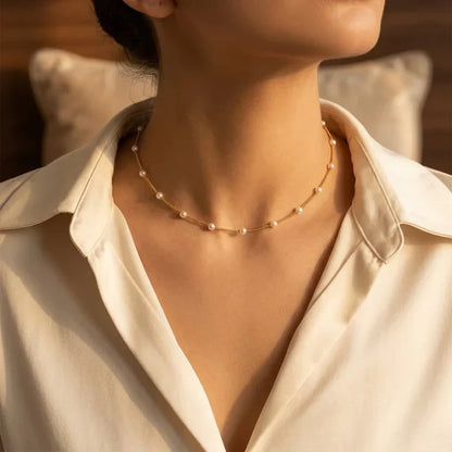 Collana con catena di perle distanziate in oro