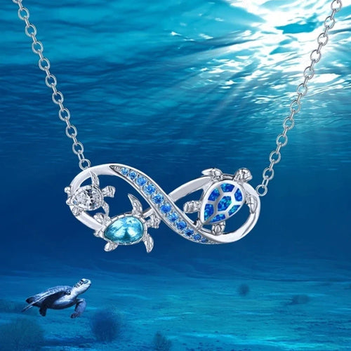 Collana Infinito con Tartarughe Marine e Cristalli Blu