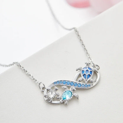 Collana Infinito con Tartarughe Marine e Cristalli Blu