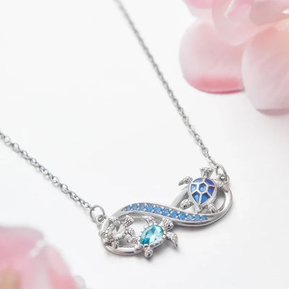 Collana Infinito con Tartarughe Marine e Cristalli Blu