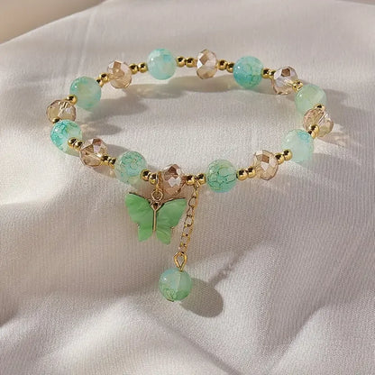 Bracciale Elastico con Perline Sfaccettate e Charm Farfalla