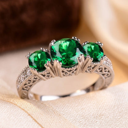 Anello a Tre Pietre in Argento e Smeraldo