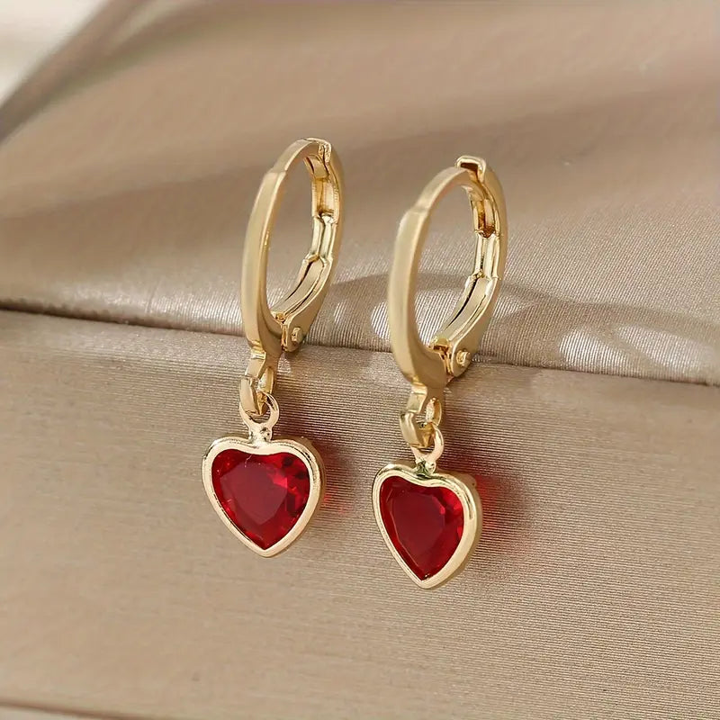 Orecchini pendenti a cuore in rubino d'oro